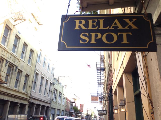 finding time to relax is a daily challenge, and is never as easy as this sign states New Orleans Relax Spot foot massage business sign
