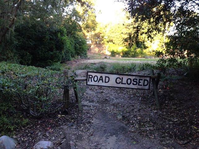 it may be closed, to vehicular traffic, but what about foot traffic? photo of a road closed sign at Kilimanjaro Safaries
