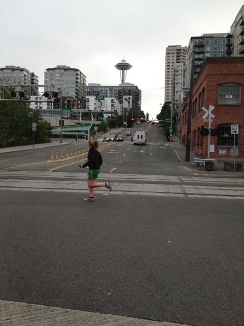 Jogger in shadow of Space Needle