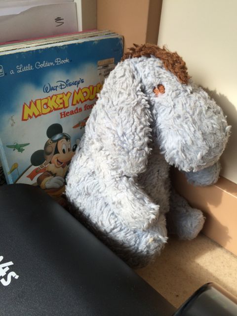 Eeyore doll and Disney children's books