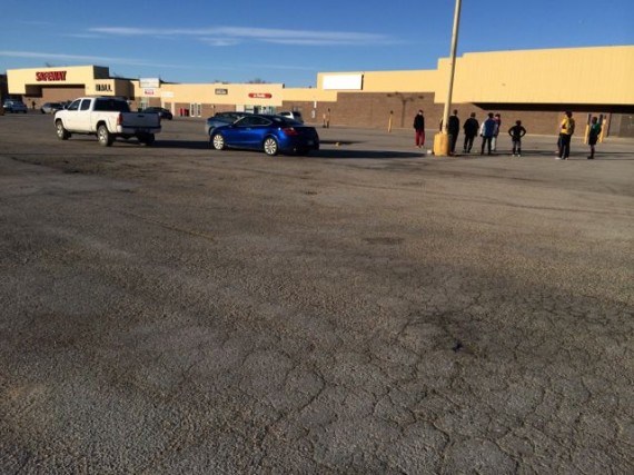 Middle aged adults conducting Rugby drills in Winnipeg parking lot