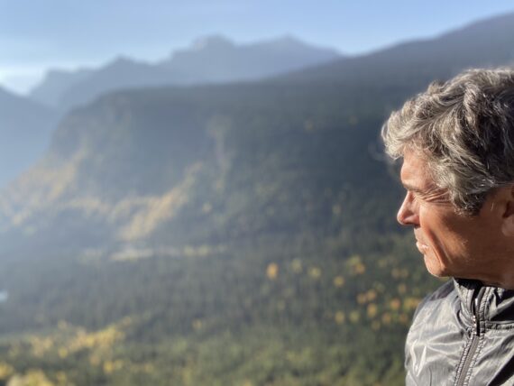 Man looking at mountains