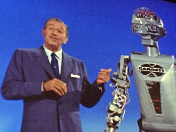 Walt Disney next to a robot