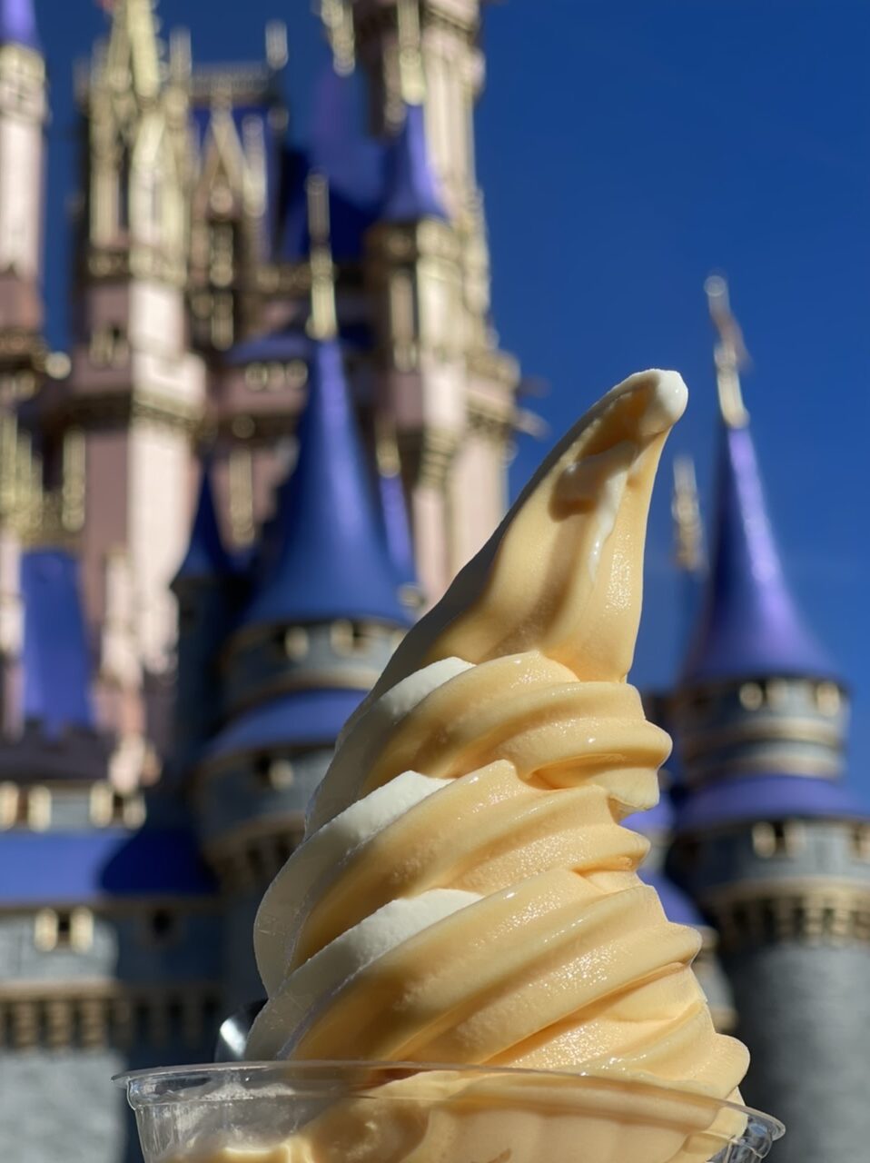 Dole whip with Cinderella Castle in the background