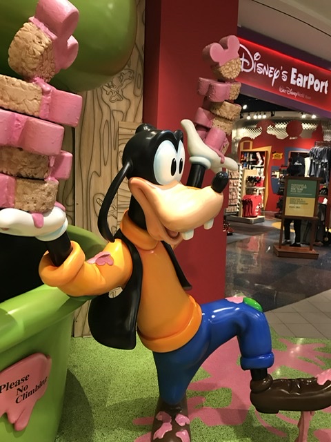 goofy statue at airport Disney store