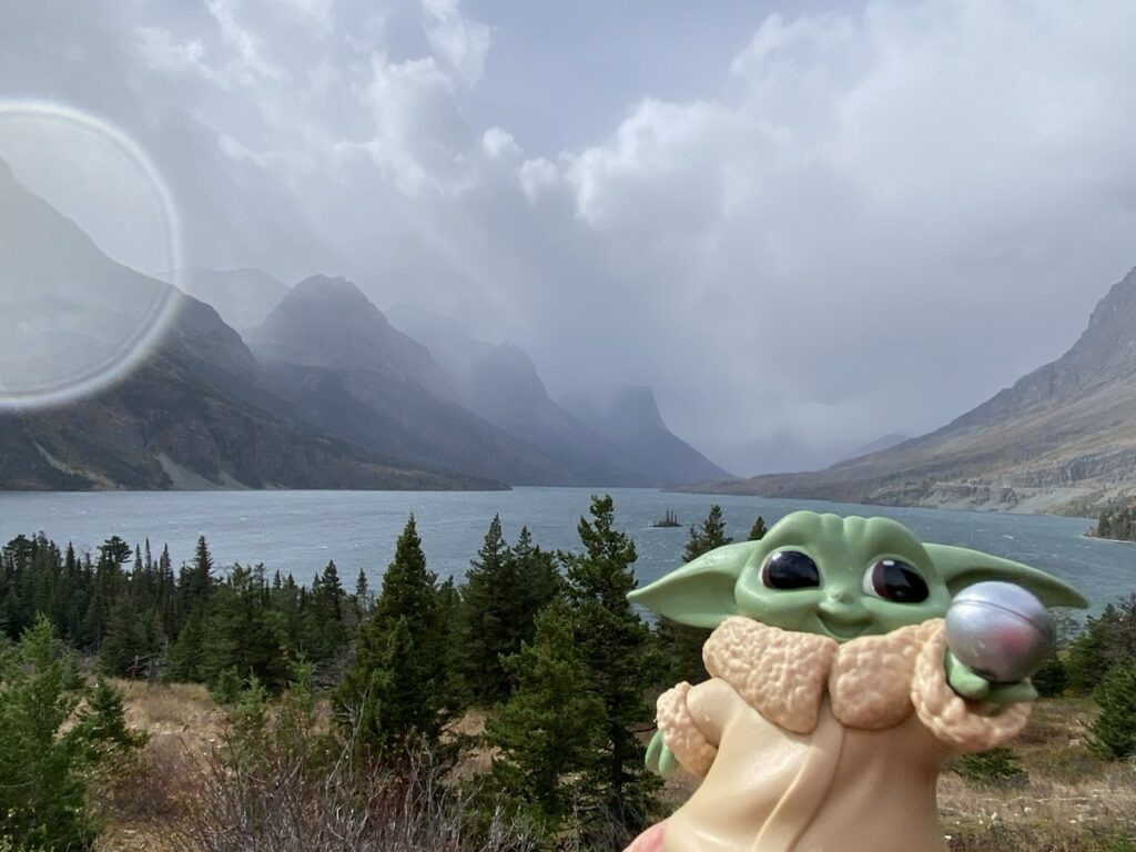 Baby Yoda toy in mountains