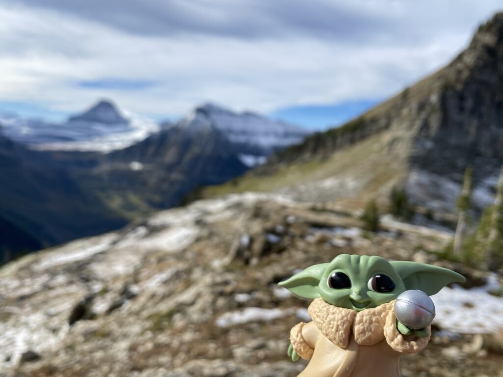 Baby Yoda toy in mountains
