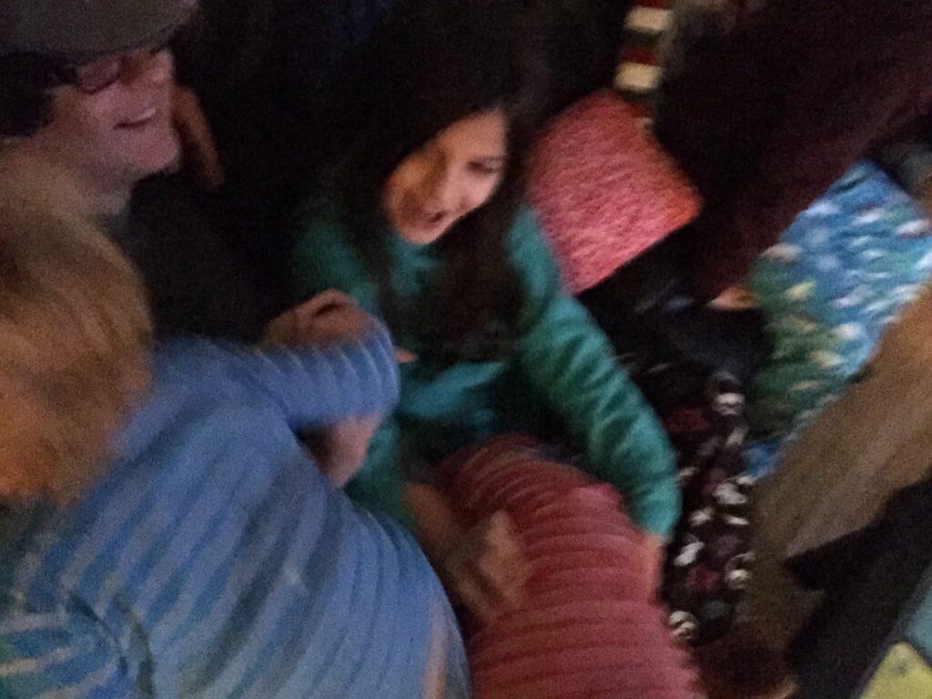 Blurry photo of family fun on a sofa