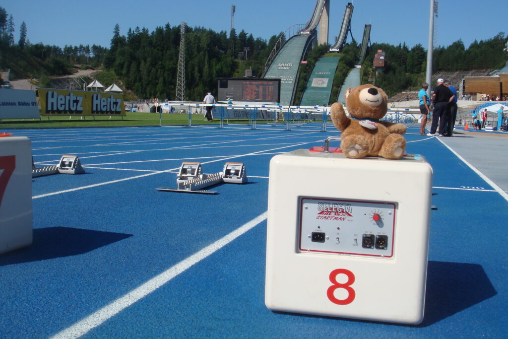 teddy bear at track and field starting line