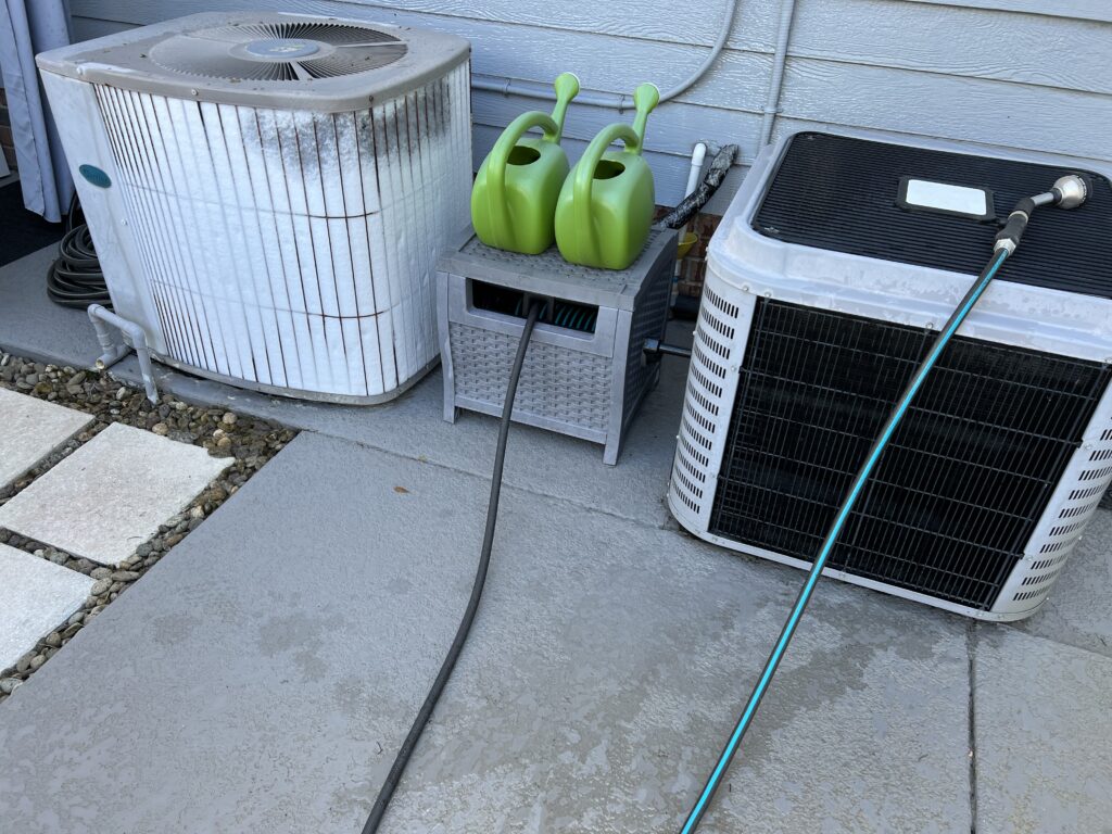 Two AC units one covered in frost
