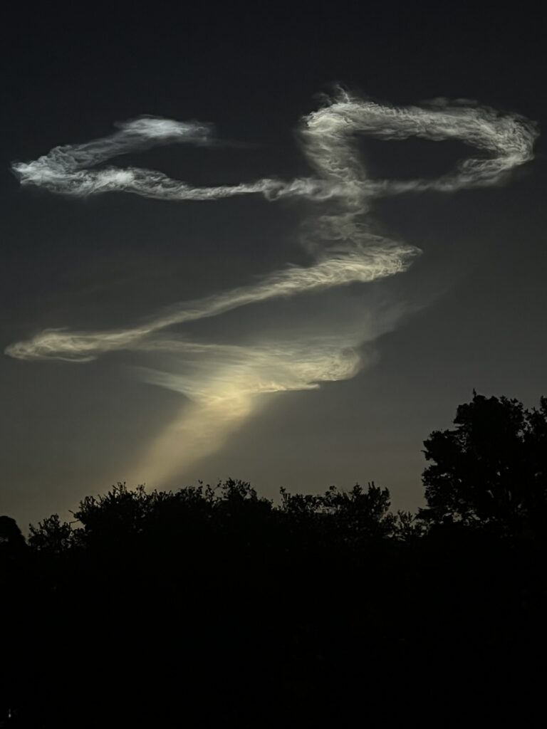 rocket launch smoke trail at dawn