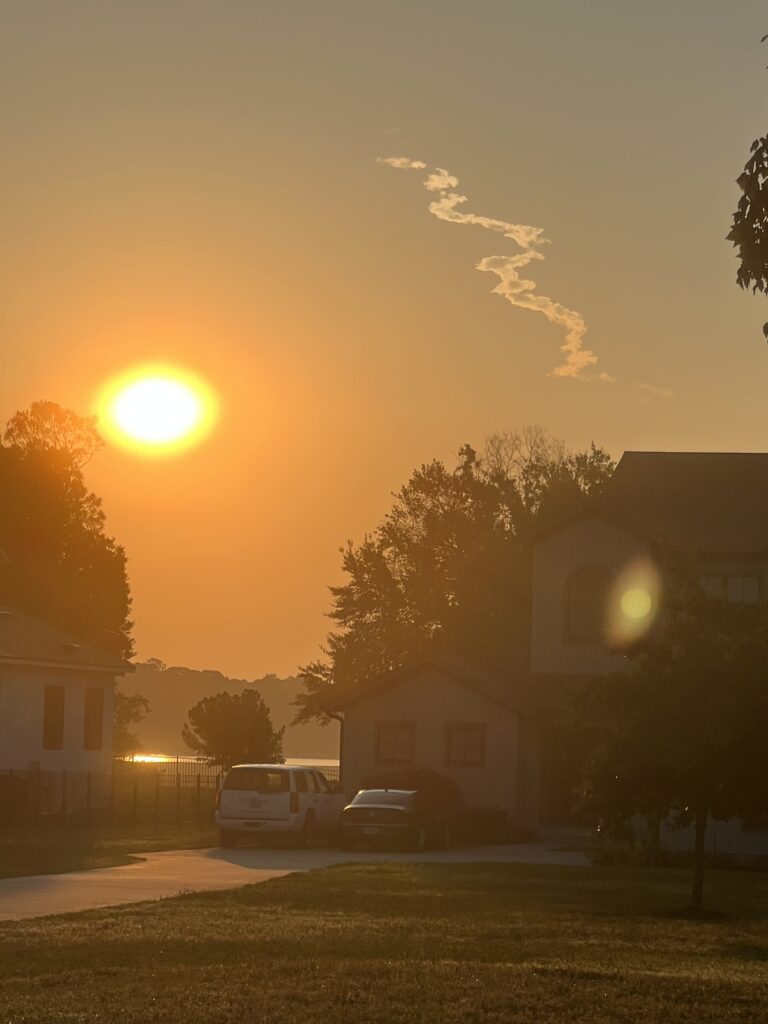 rocket launch smoke trail at sunrise