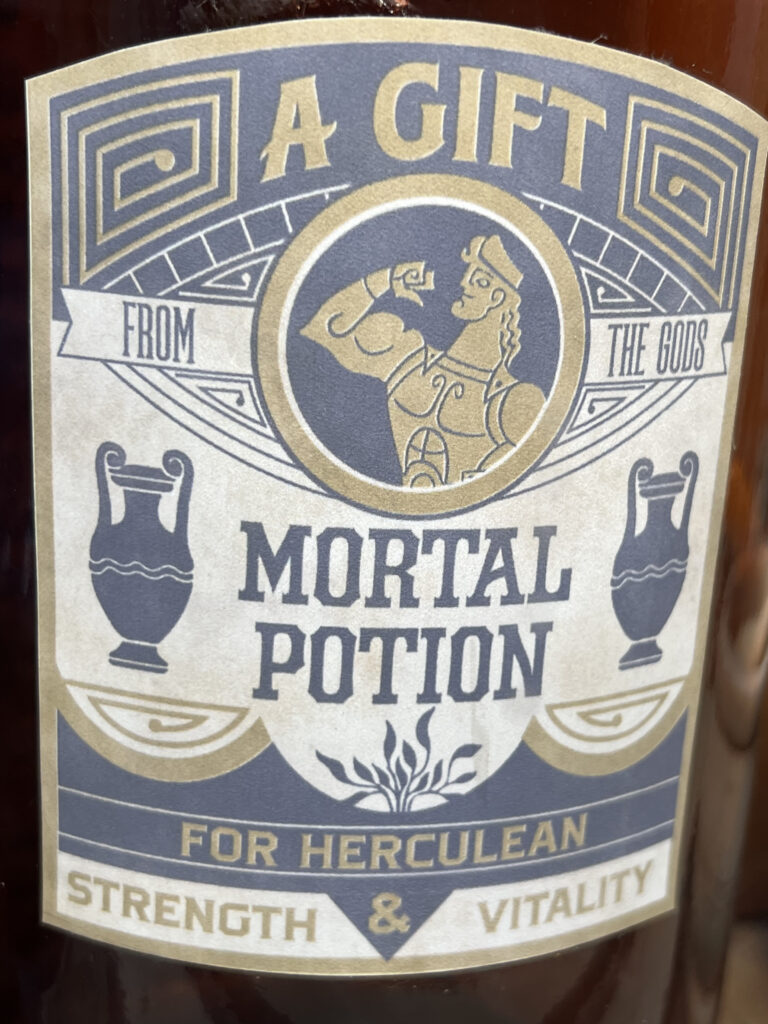 Disney Park window display closeup of a funny bottle label