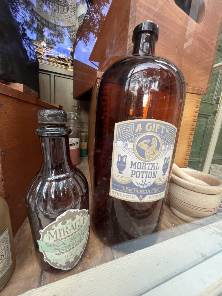 Disney Park window display closeup of a funny bottle label