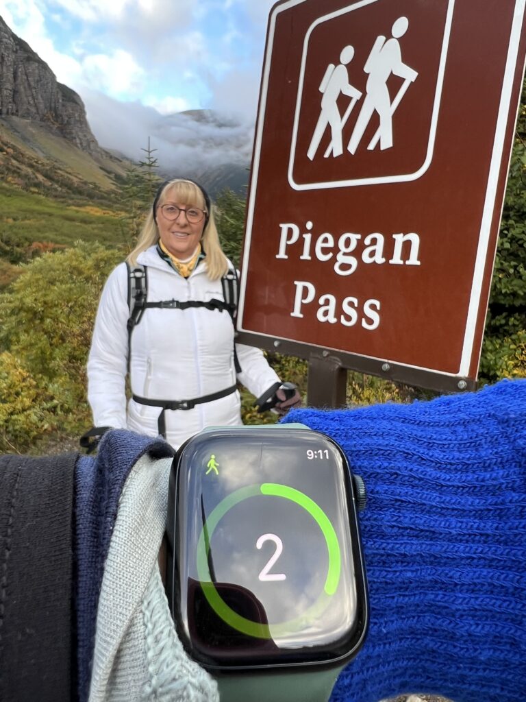 Woman at trail head sign